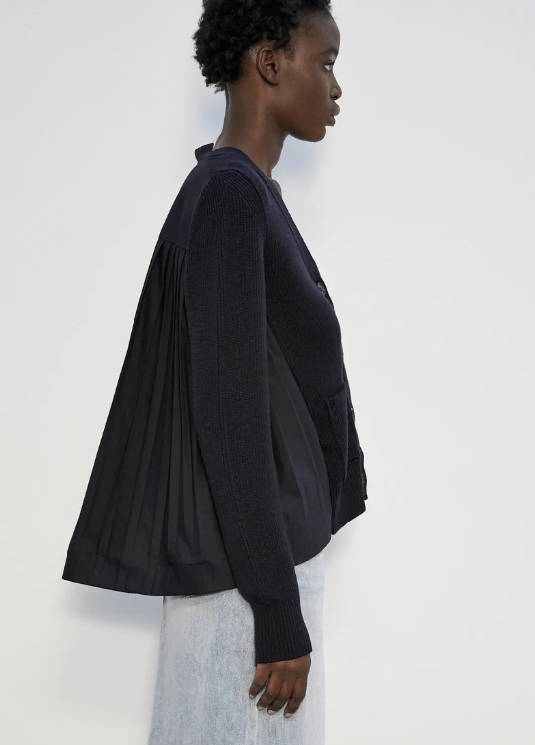 RIBBED CARDIGAN WITH POCKETS AND PLEATED FABRIC AT THE BACK